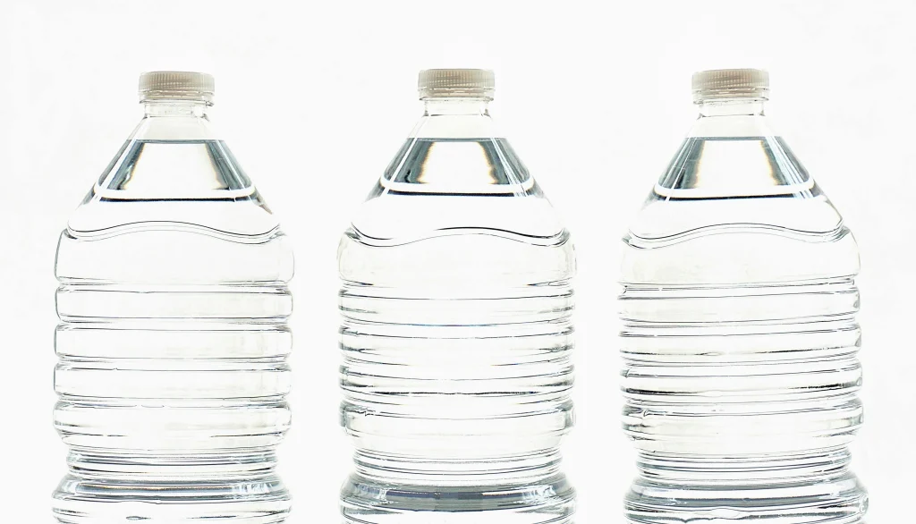 3 bottles of water on a white background