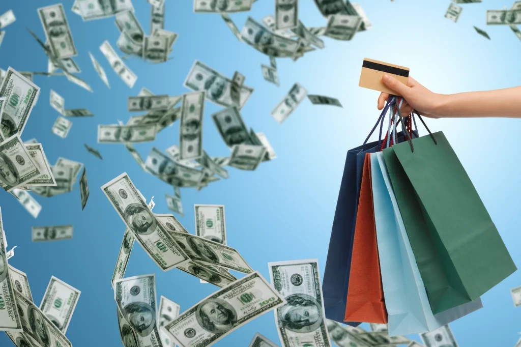 money falling shopping bags