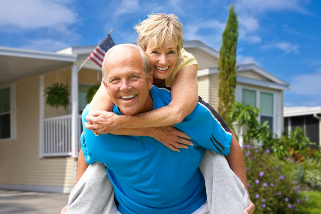 couple outside mobile home