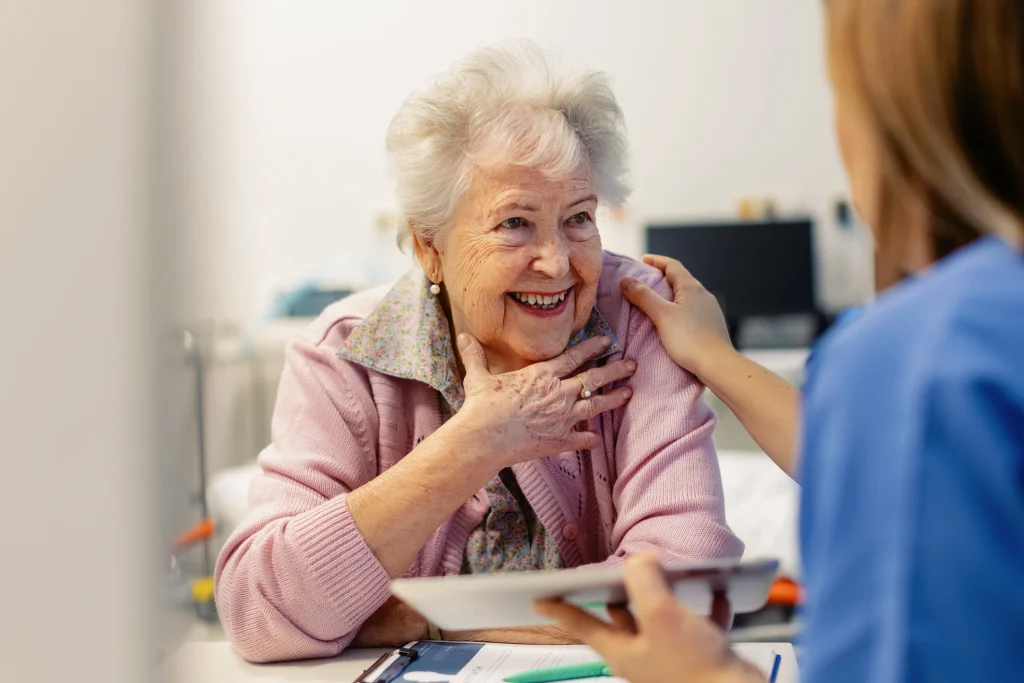 senior woman dementia patient and a caregiver smiling