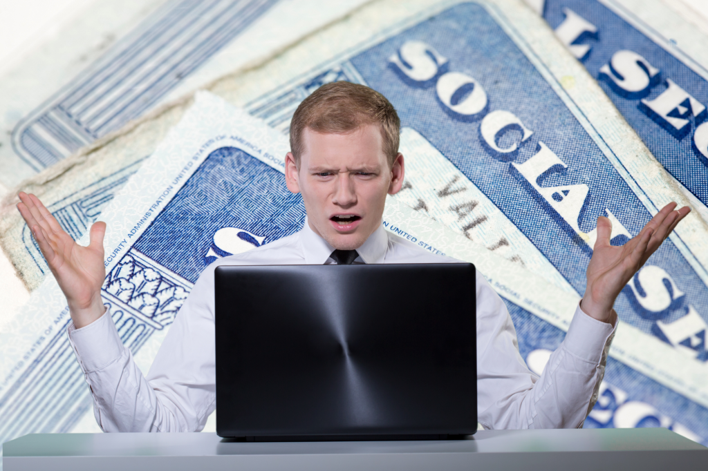 man distraught at desk