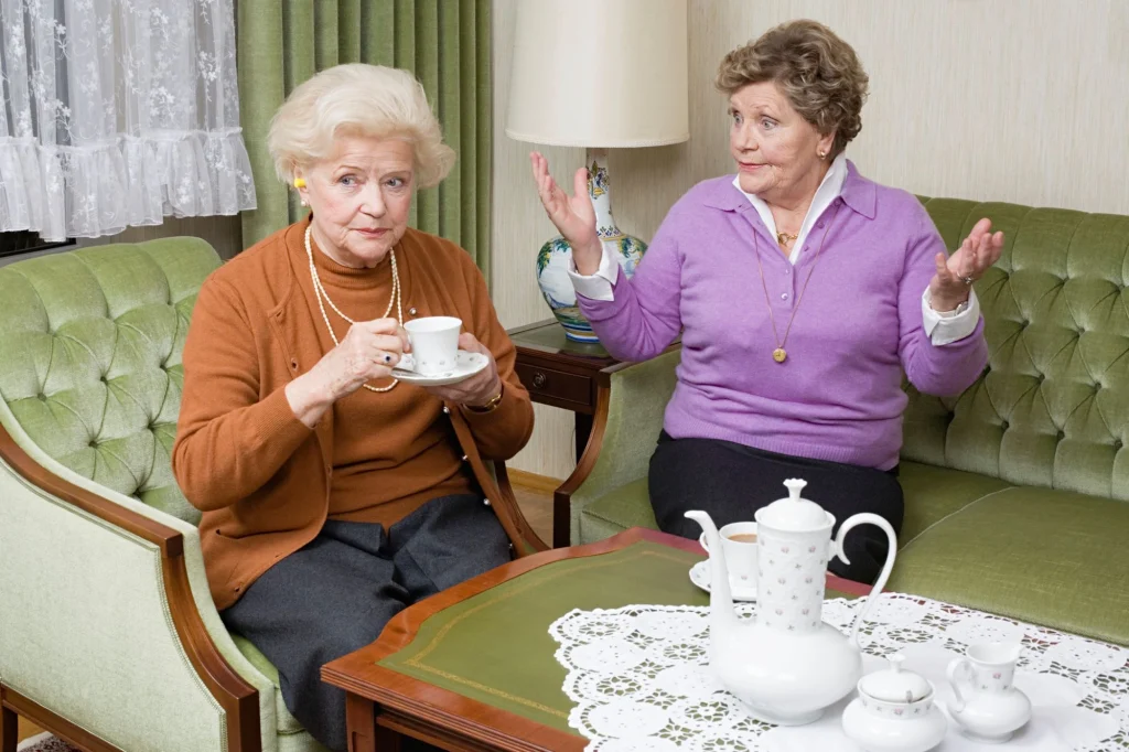 senior friends fighting on the couch