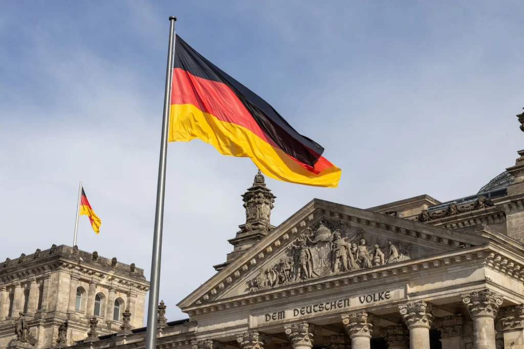 german flag flying in front of building