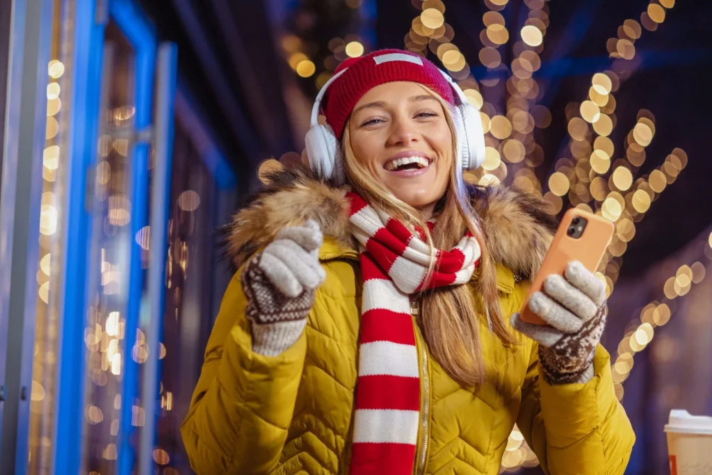 girl dancing with phone headphones