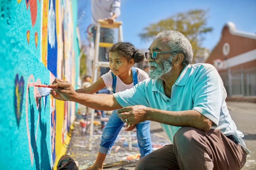 grandpa and granddaughter volunteering