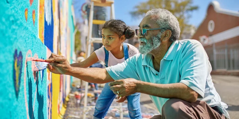 grandpa and granddaughter volunteering