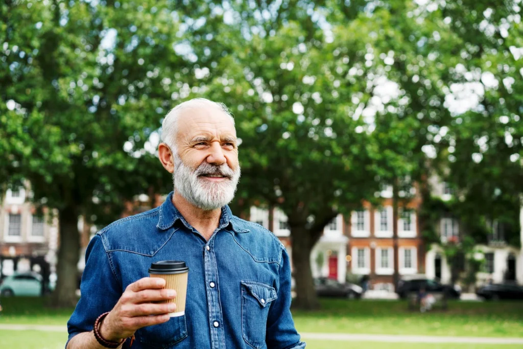 man with coffee in hand