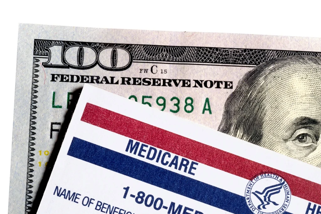 medicare card and a one-hundred dollar bill