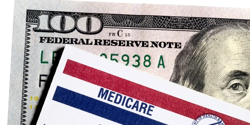 medicare card and a one-hundred dollar bill