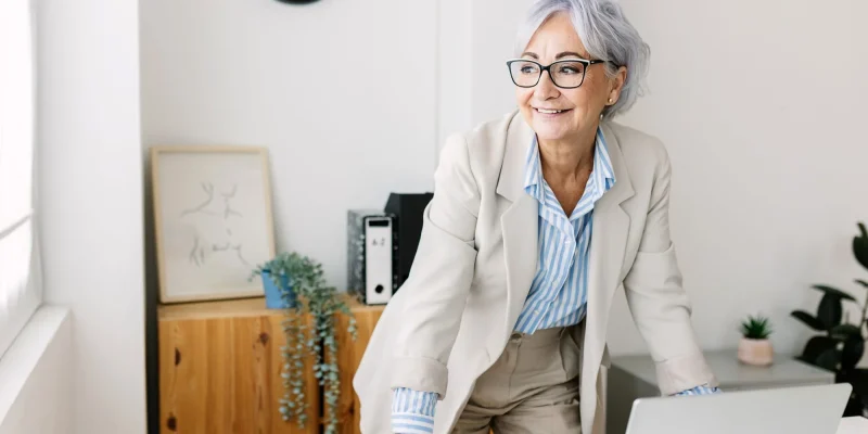 Elderly woman at work looking confident in her negotiation skills