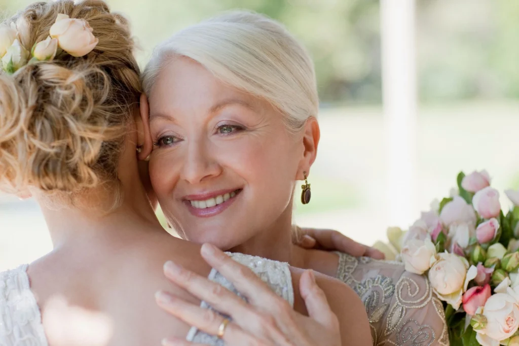 momh hugging bride