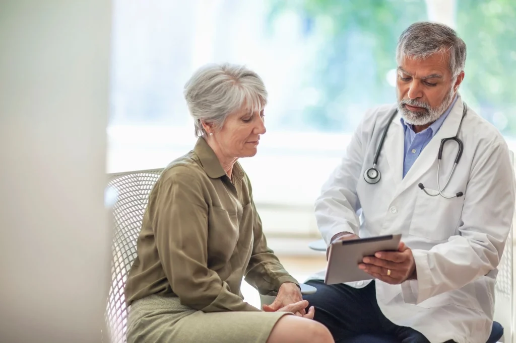 patient talking to a doctor in the office