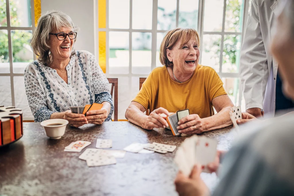 ladies playing cards and laughing