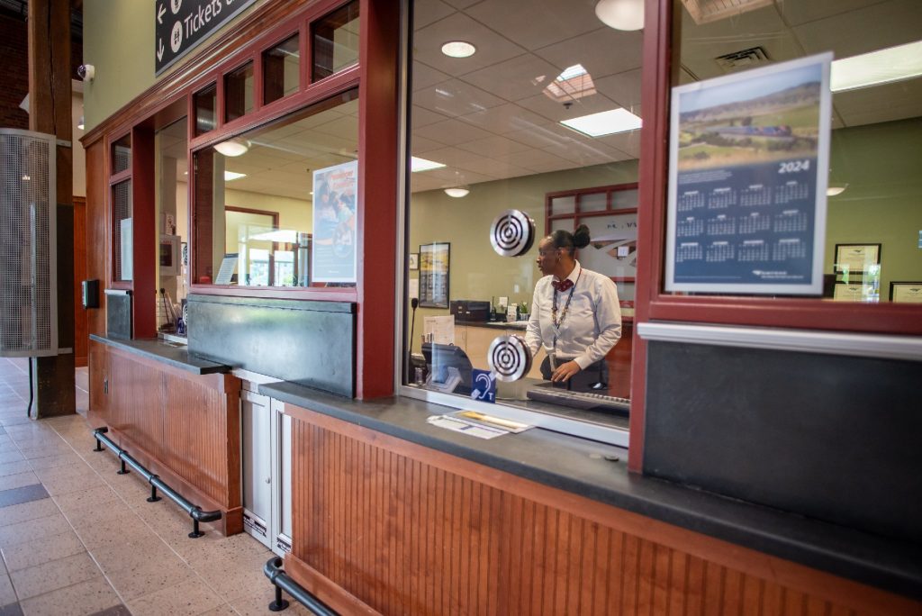 A horizonal bar in Amtrak stations alerts passengers with canes that they are approaching the ticket counter. Photo courtesy of Amtrak.