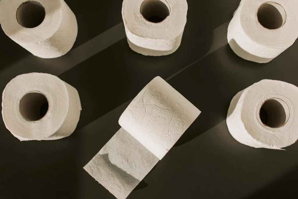 several rolls of toilet paper on a black background