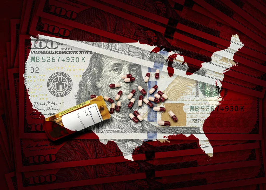 RX pharmacy prescription bottle of pills on a pile of $100 dollar bills and a USA outline