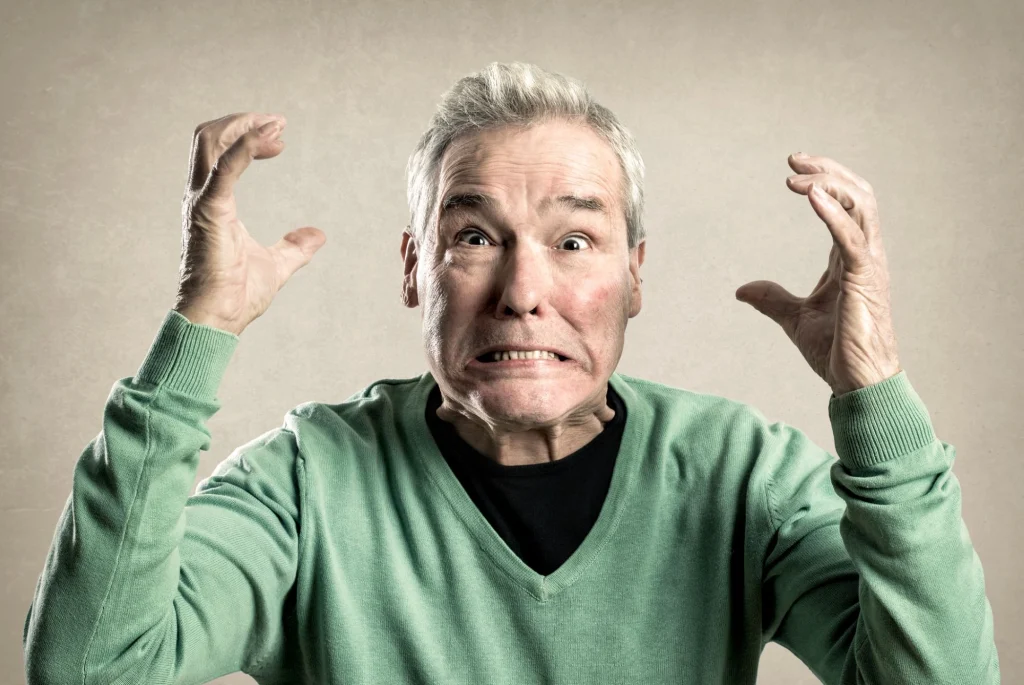 angry man in a green shirt