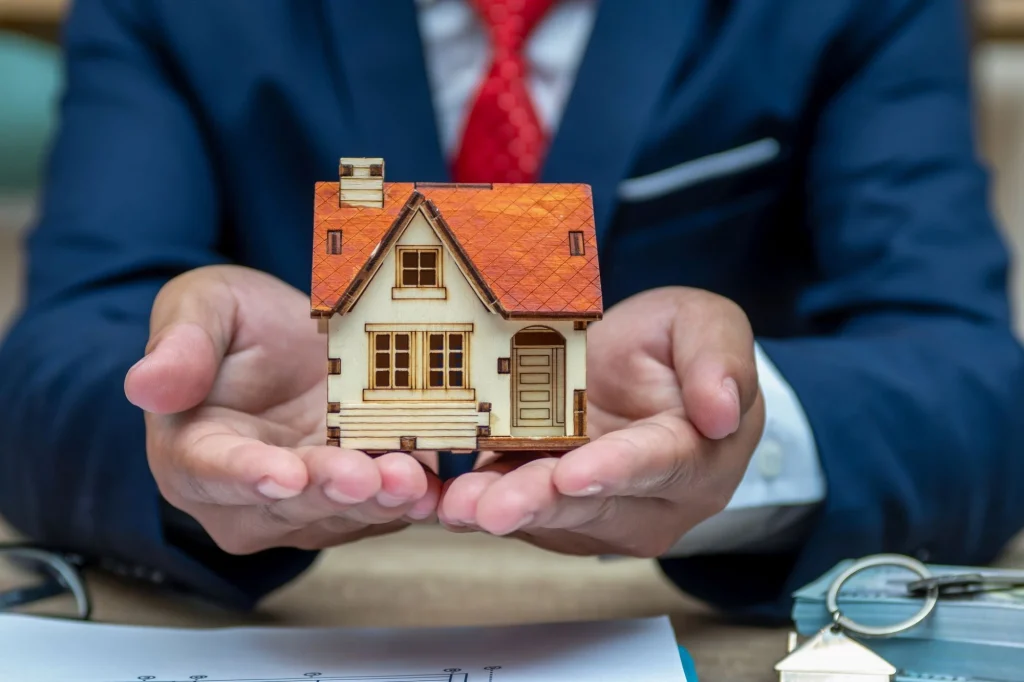 little house in cupped hands