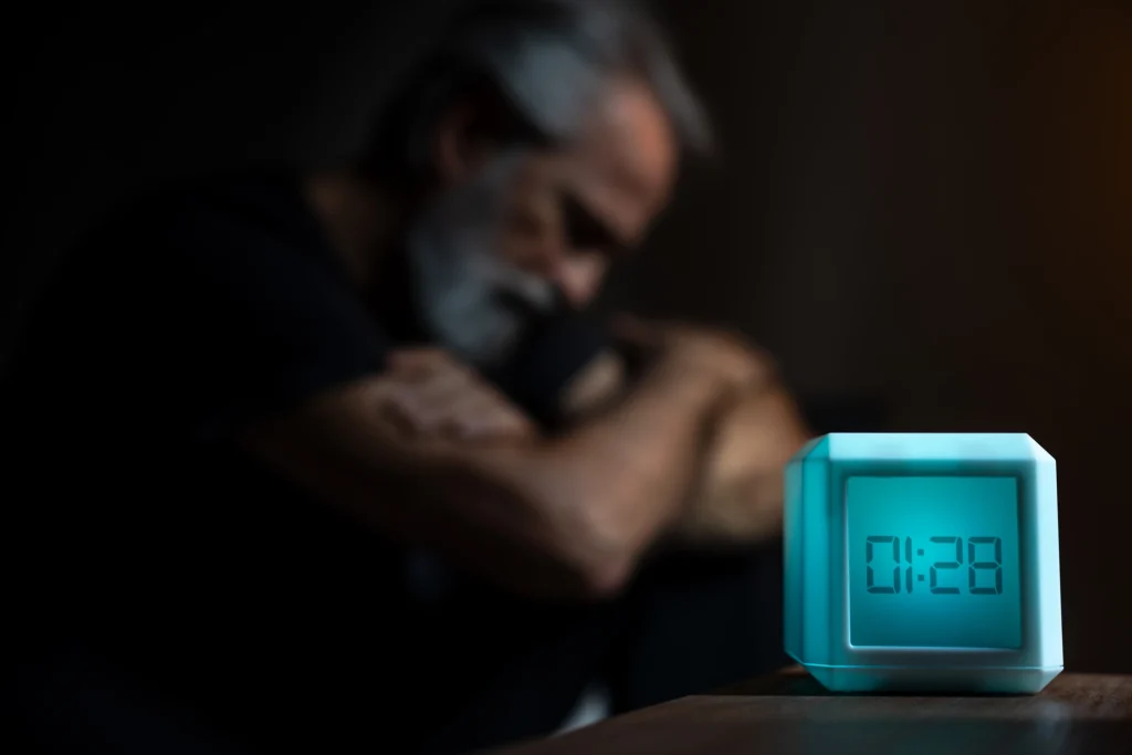 senior adult man can't sleep because of insomnia