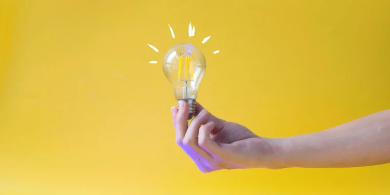 lightbulb on a yellow background, illustrating idea
