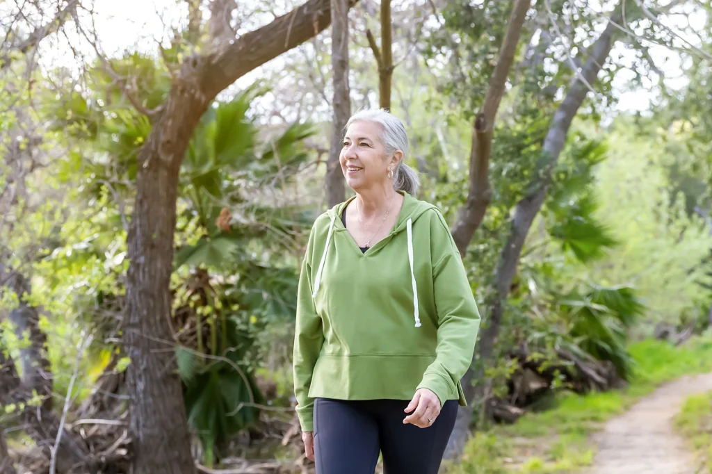 lady in green jacket walking