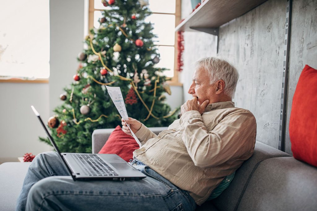 older man stressed about holiday finances