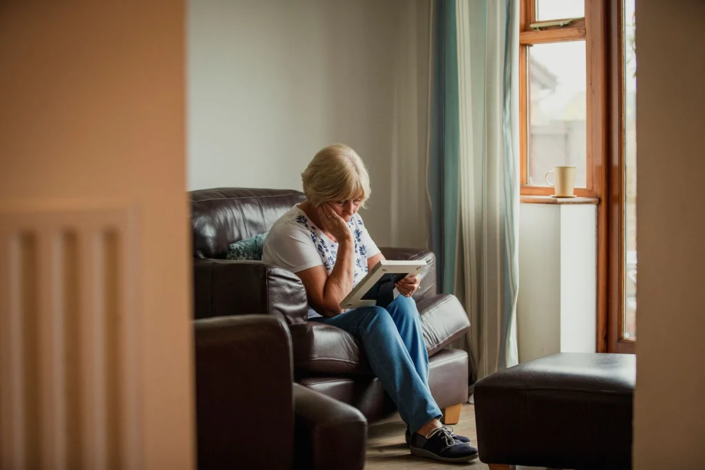 sad lady looking at photo frame