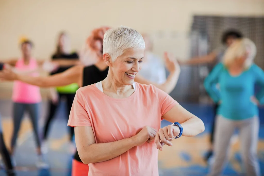 older lady looking at fitness watch