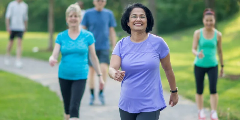 senior walking in the park