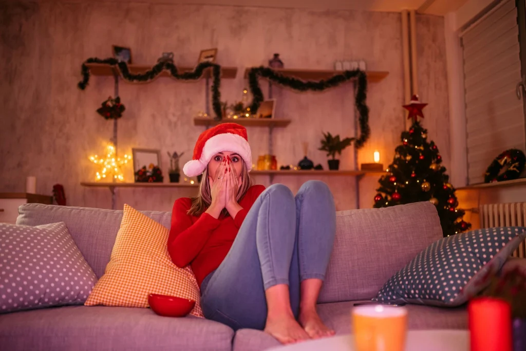 woman on couch shocked