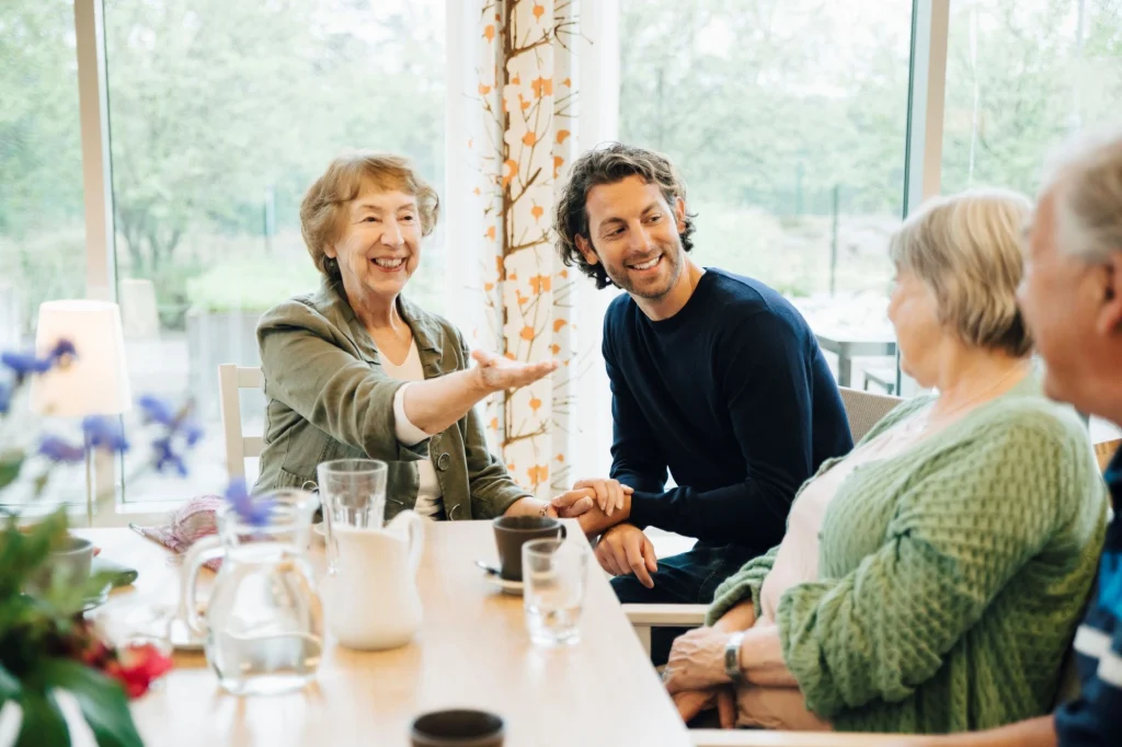 adult day care group having fun at a table