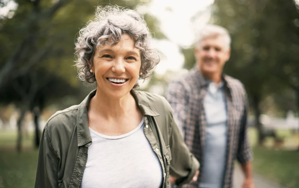 couple walking outside in the park