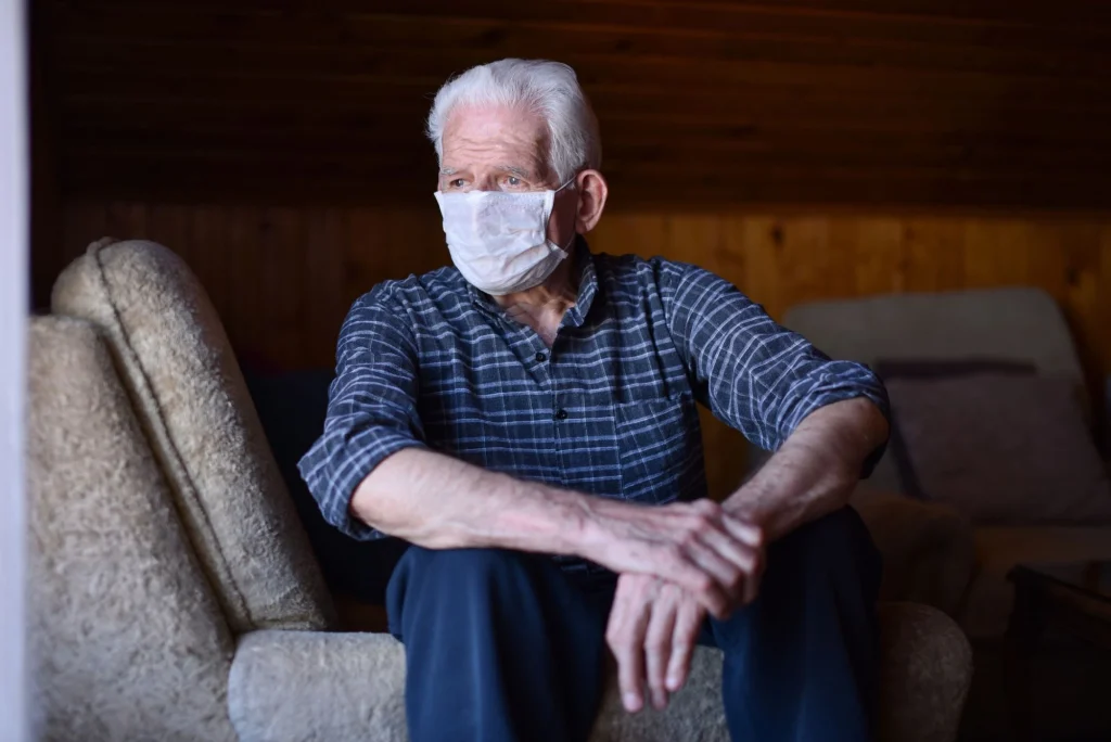 covid mask senior sad