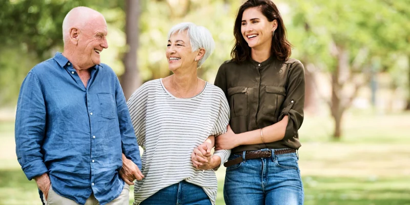 daughter with older parents walking