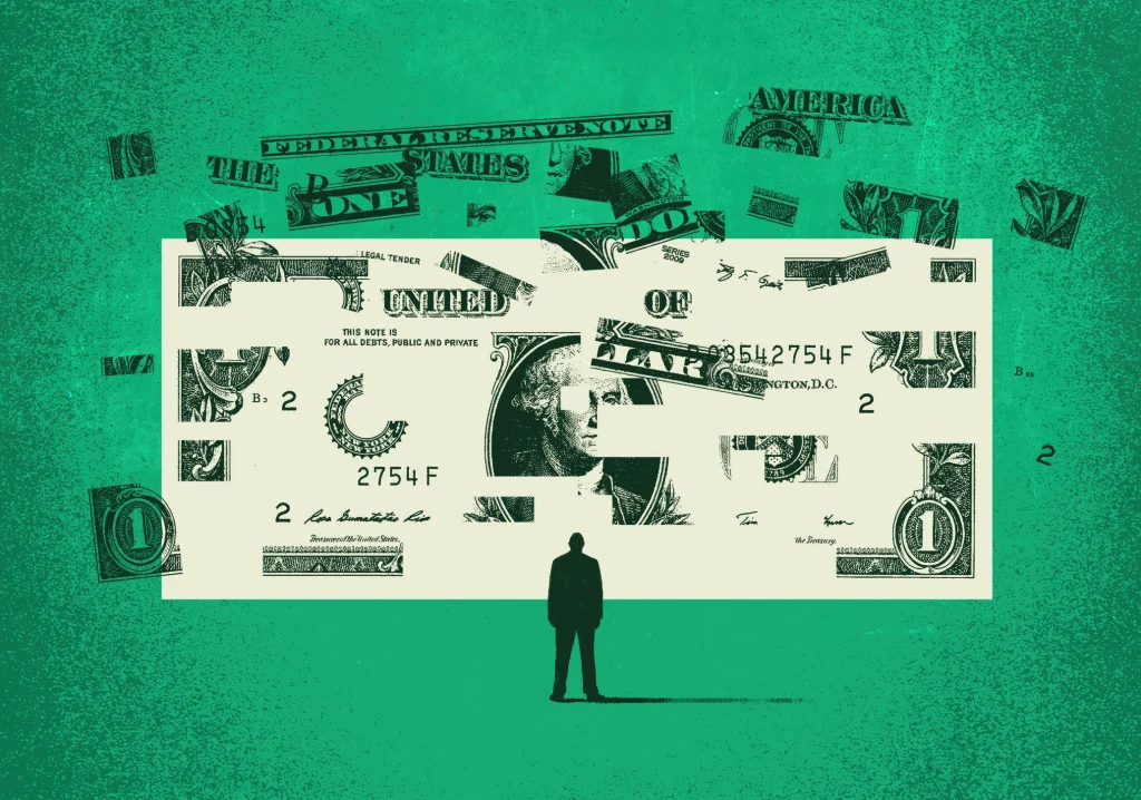 man looking at dollar bill breaking apart symbolizing money gap