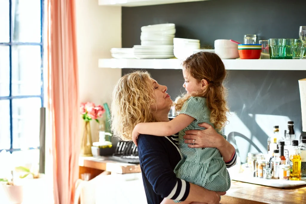grandma hugging her granddaughter