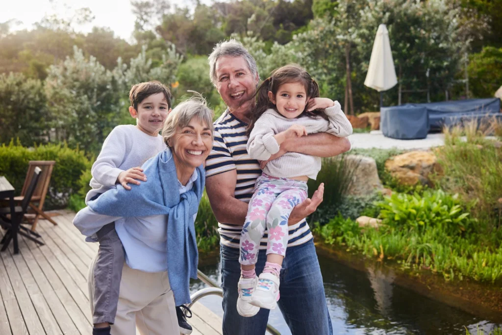 grandparents with grandkids outside on deck