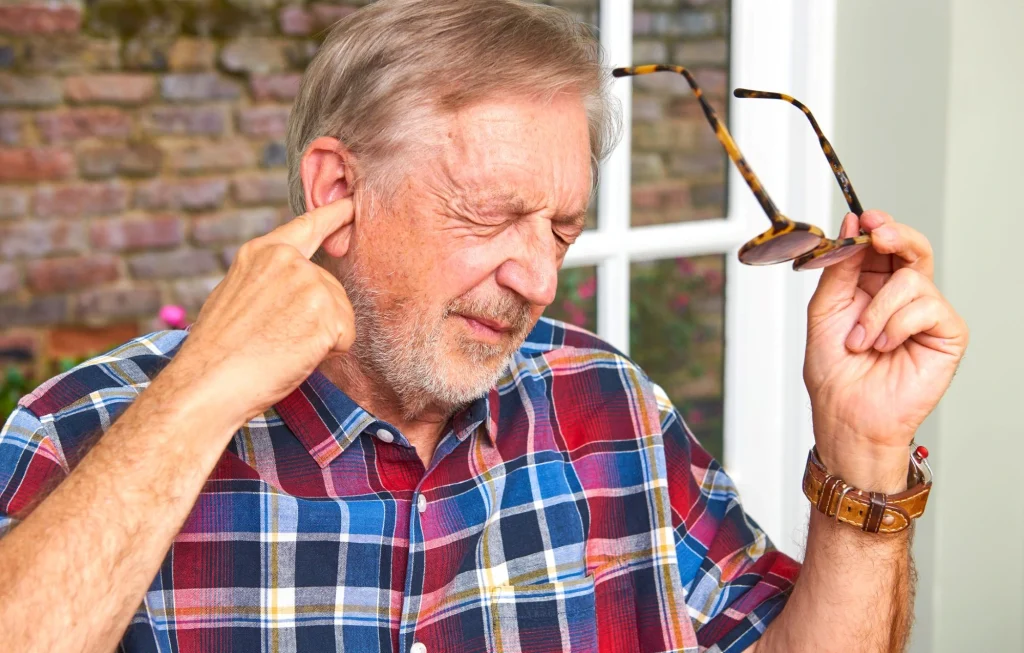 older man ear ache earwax problems