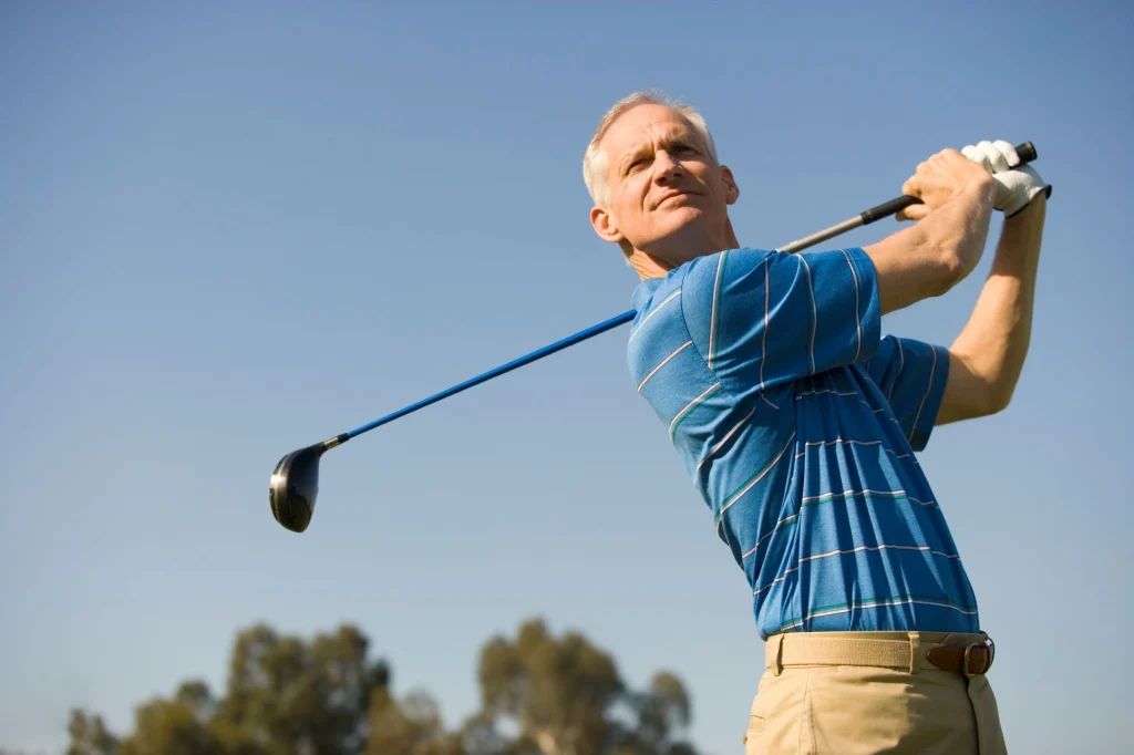 mature  golfer on the range