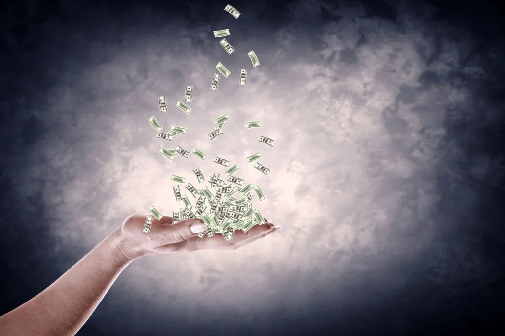 money falling into palm