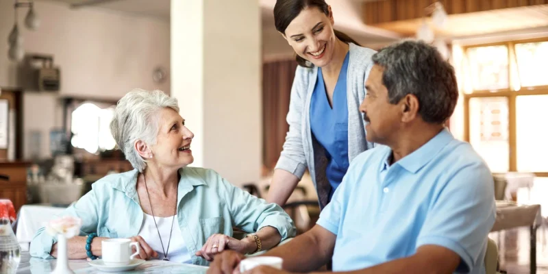 nurse checking on residents in assisted living