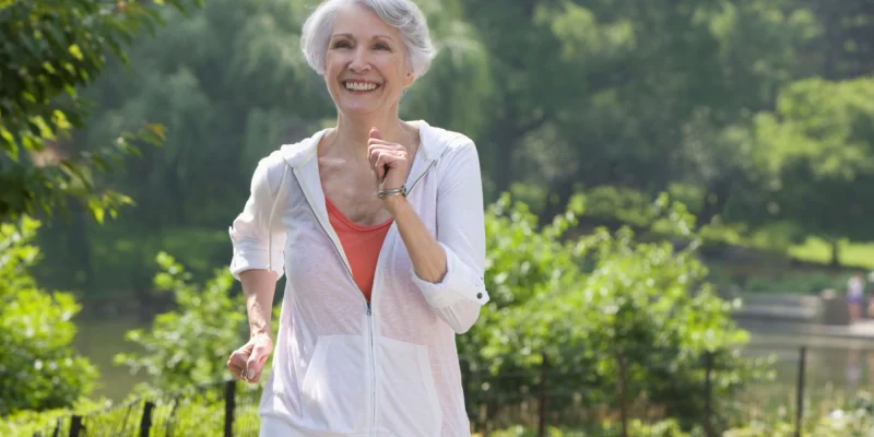 older senior woman jogging in the park
