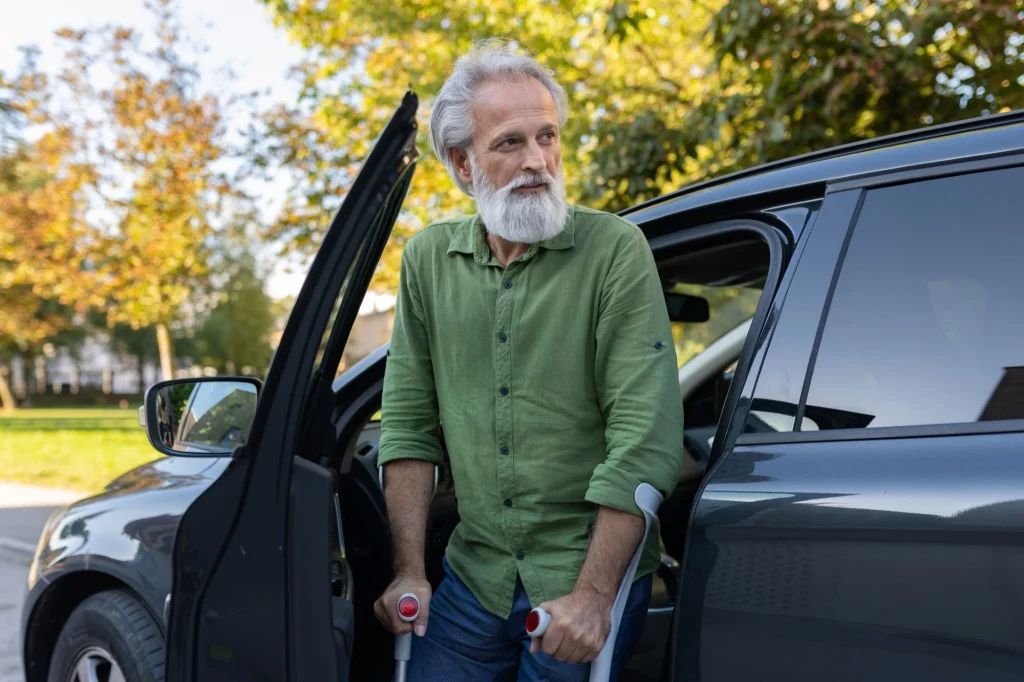 older man getting out of the car