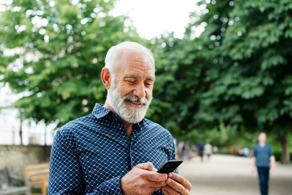 older man on his cell phone technology for seniors