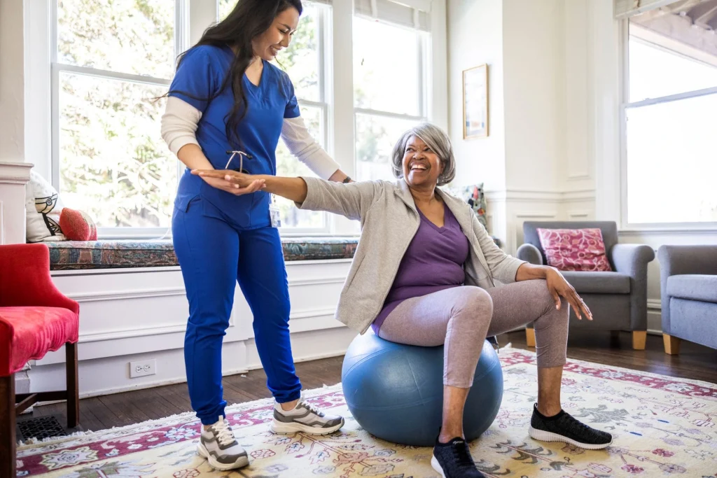 physical therapist with patient in-home care