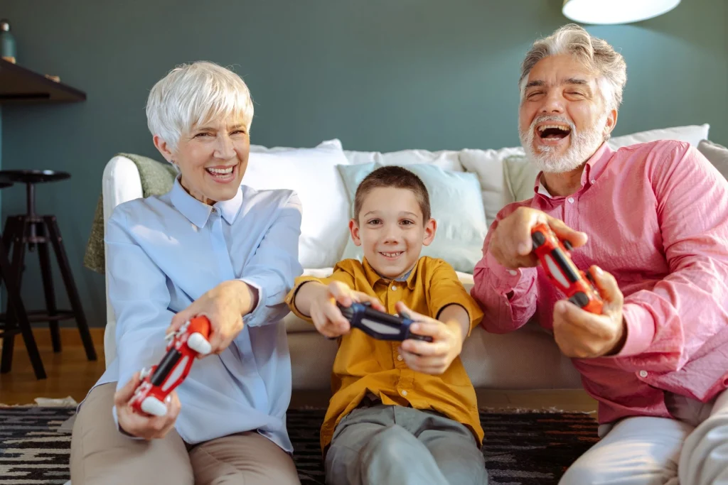 grandparents playing a game with their grandson