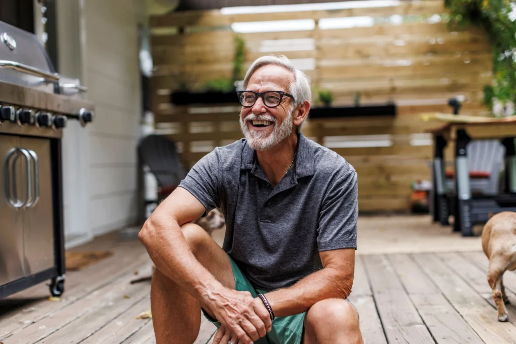 retiree sitting on the porch outside warm summer day