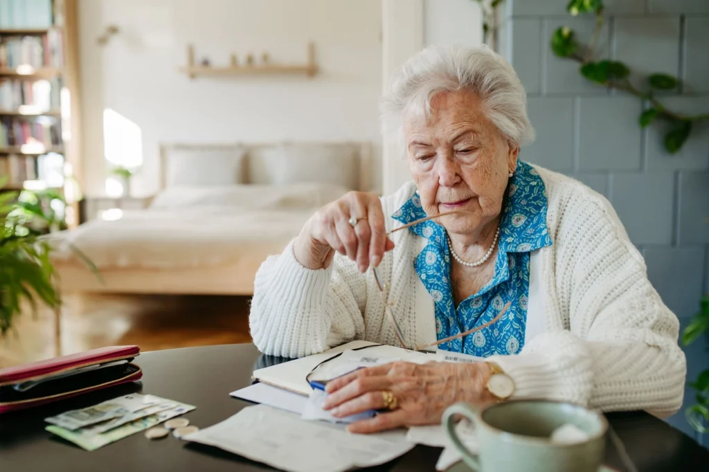 senior lady stressed over bills and fees