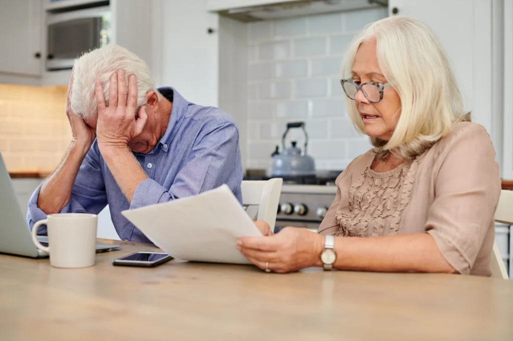 senior couple fighting stressed over money