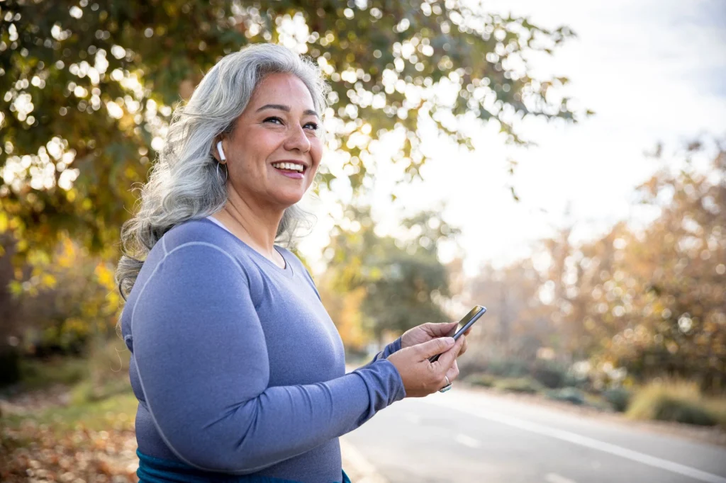 senior lady listening to a podcast